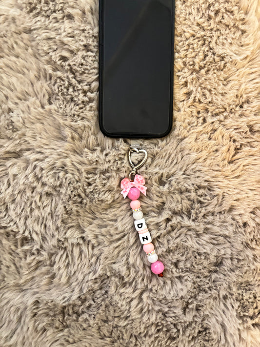 Accessoire portable avec lanière