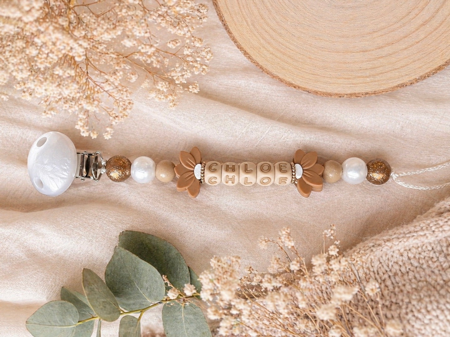 Attache tétine double fleur de lys