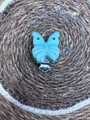 Clip papillon vert sauge pailletée