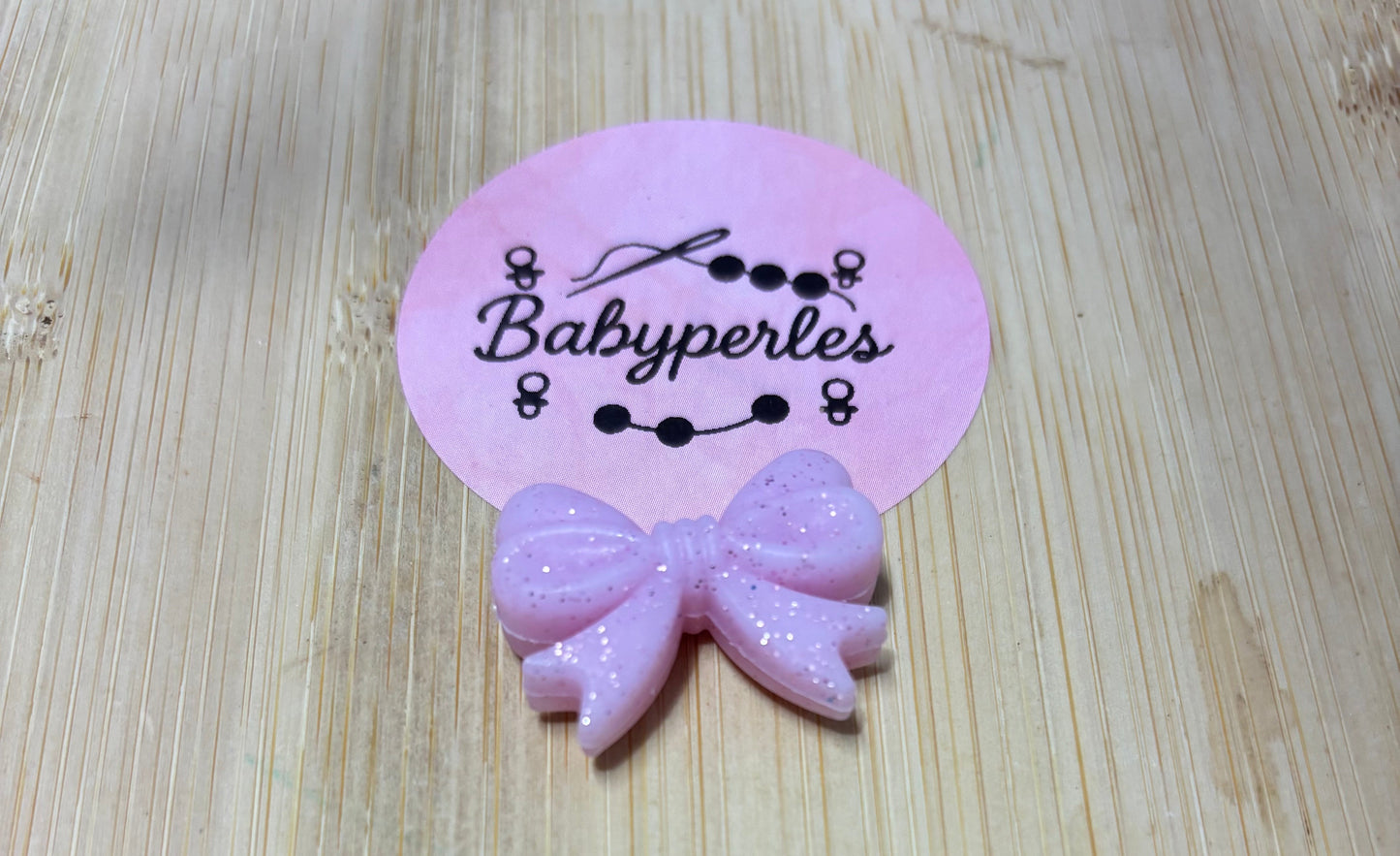 Noeud de papillon pailletée rose clair