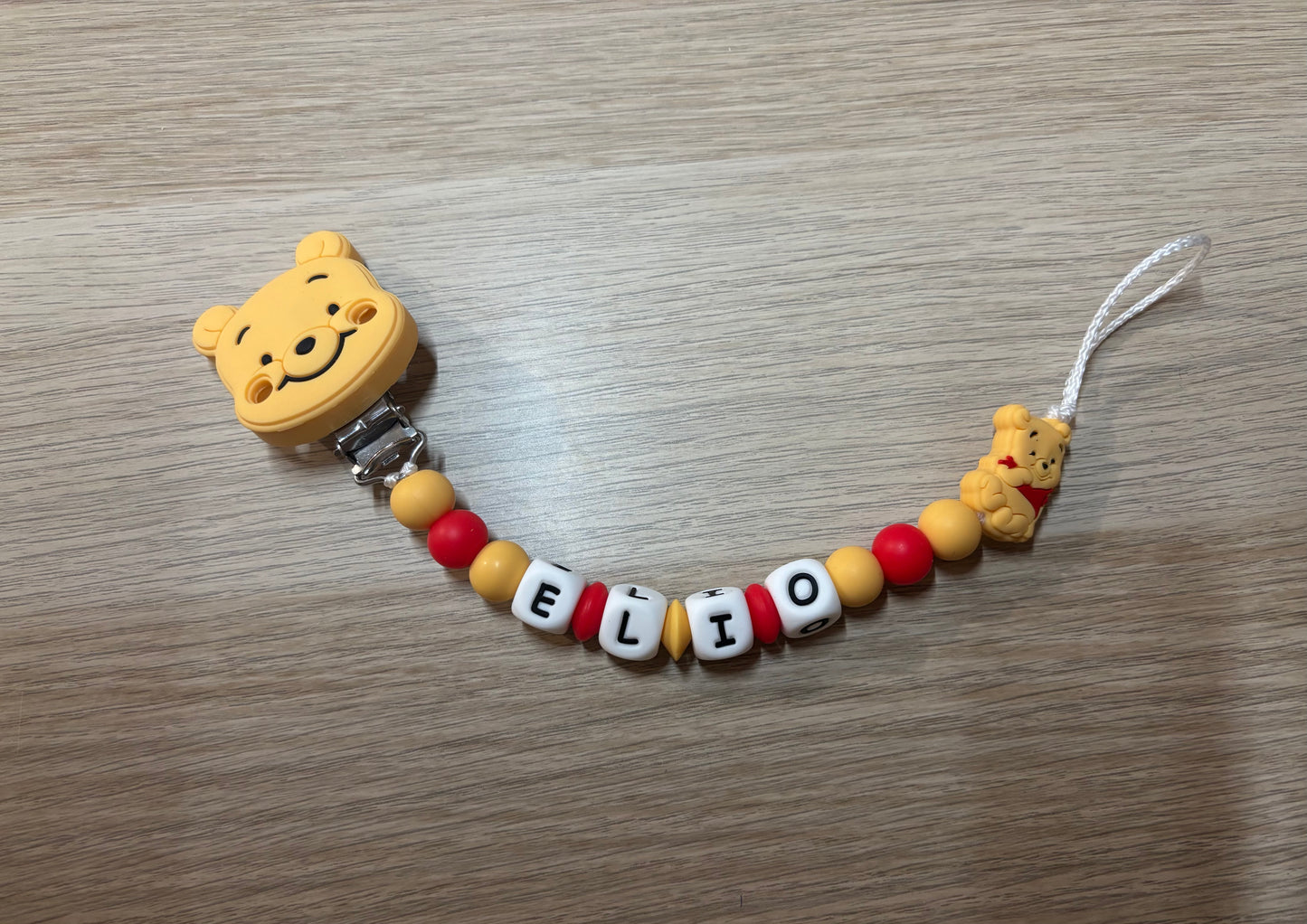 Attache tétine Winnie l’ourson