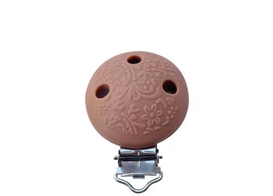 Clip embossé camel