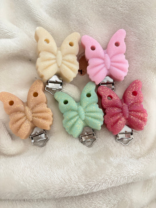 Attache tétine papillon pailletée