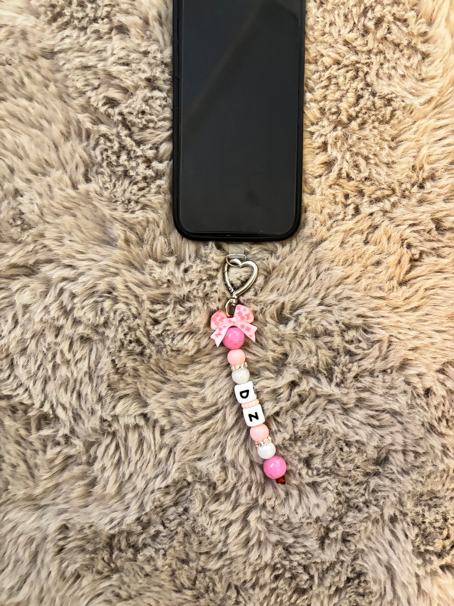 Accessoire portable avec lanière