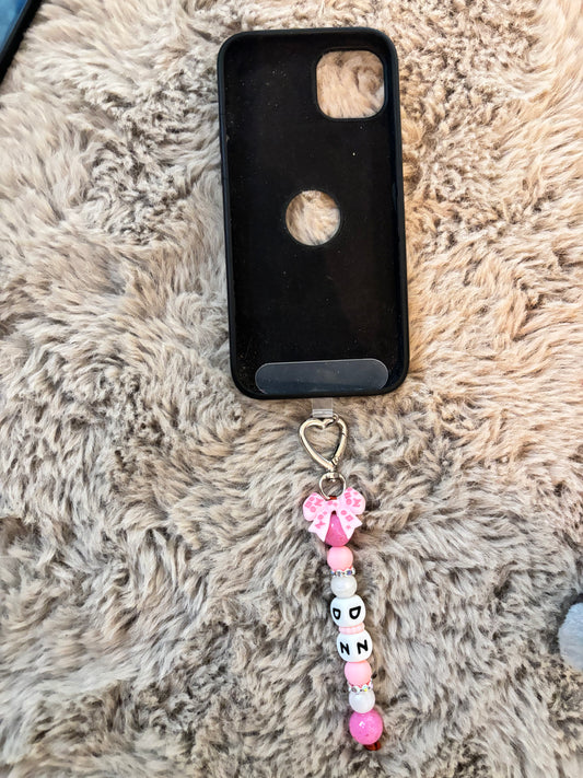 Accessoire portable avec lanière