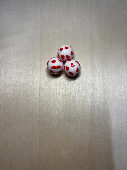 Perles petits cœurs rouge 15 mm