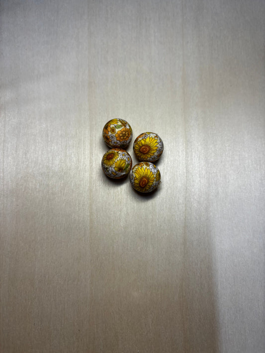 Perle à thème fleurs jaunes 15 mm